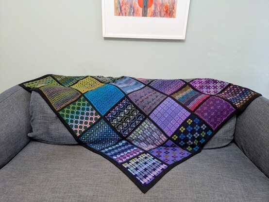 Knitted blanket over the back of a sofa