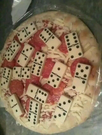 A pizza covered in dominoes.