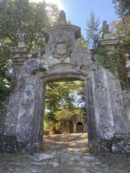 An old stone arch at the entrance to a disused winery