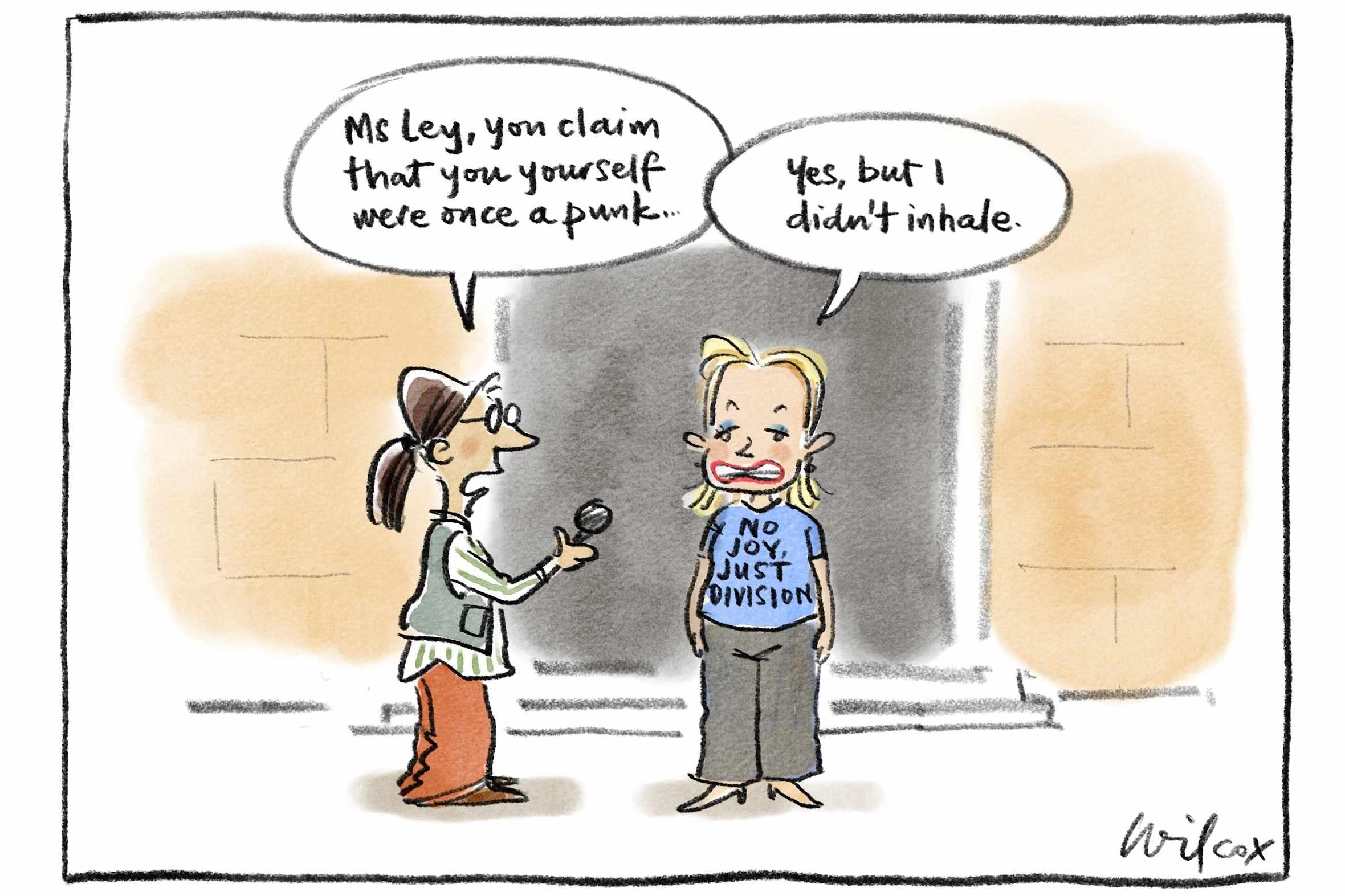 Susan Ley with t shirts that says “no joy, just division”