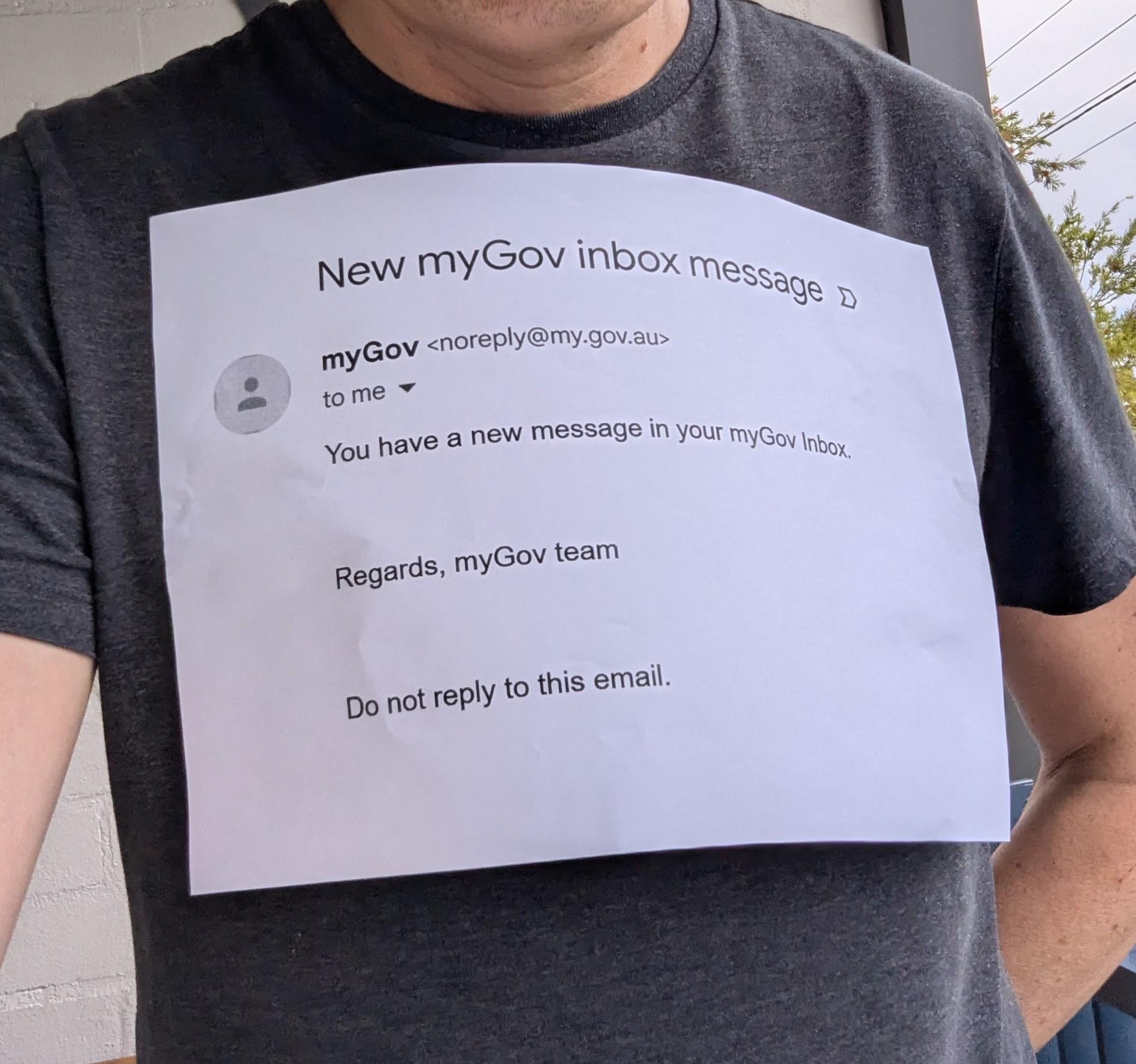 It's me with a printed out myGov email "you have a new message in your myGov inbox" stuck to my chest