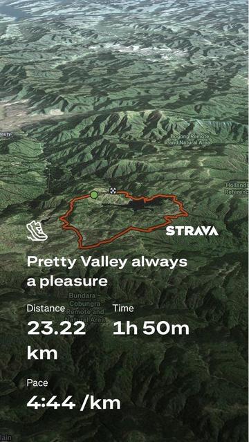 A screenshot of a Strava activity map showing a route through a hilly landscape. Details include a distance of 23.22 km, a time of 1 hour and 50 minutes, and a pace of 4:44 per kilometer.