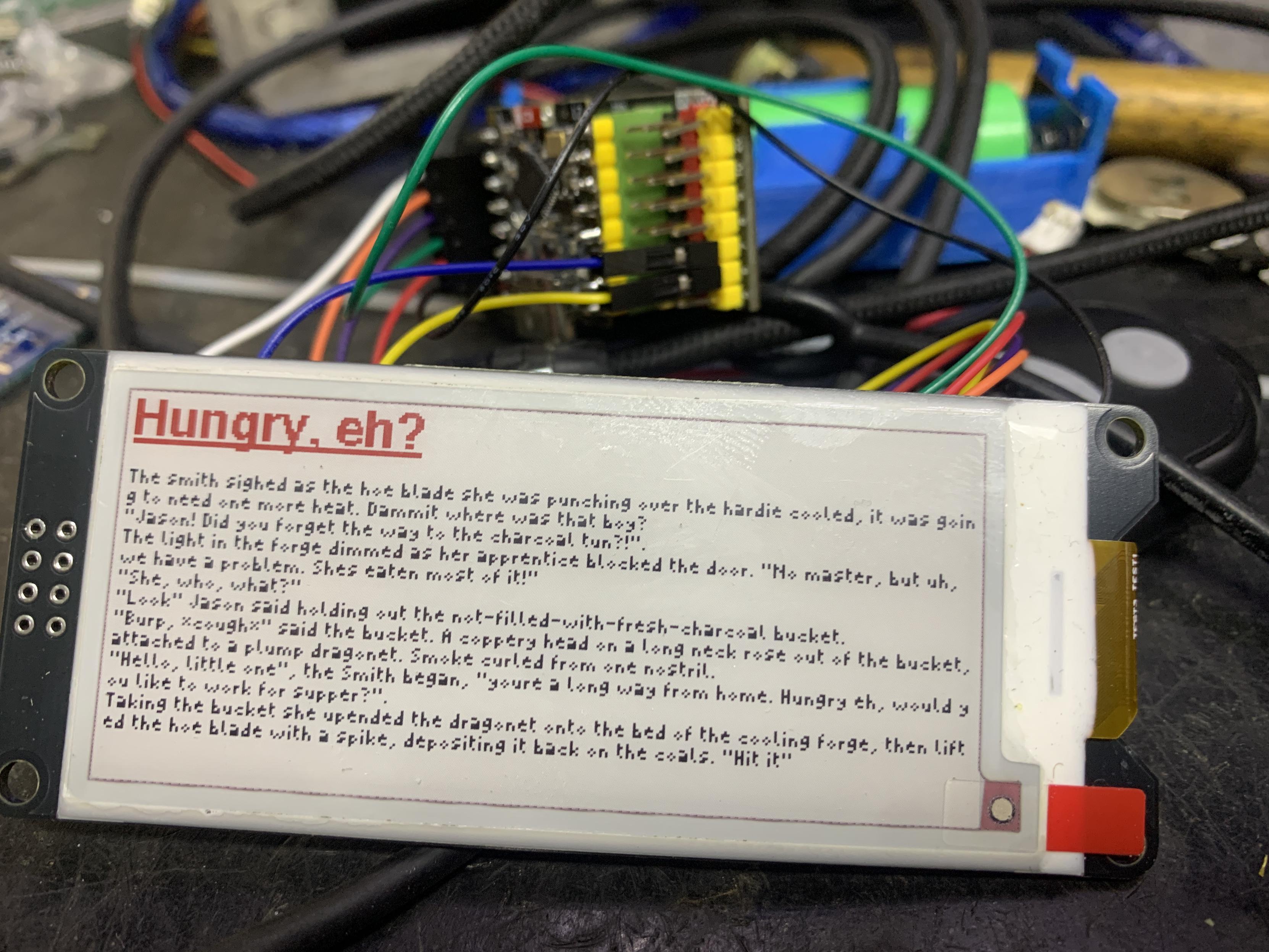 A small black/white/red epaper display about the size of those supermarket price tags (75mm diagonal, 290x128 pixels). It has one of my microfiction toots displayed in a tiny font. Relax, I have bigger epaper screens in transit.