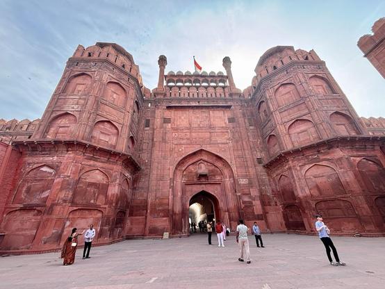 Red sandstone towels and gatehouse rising into the sky