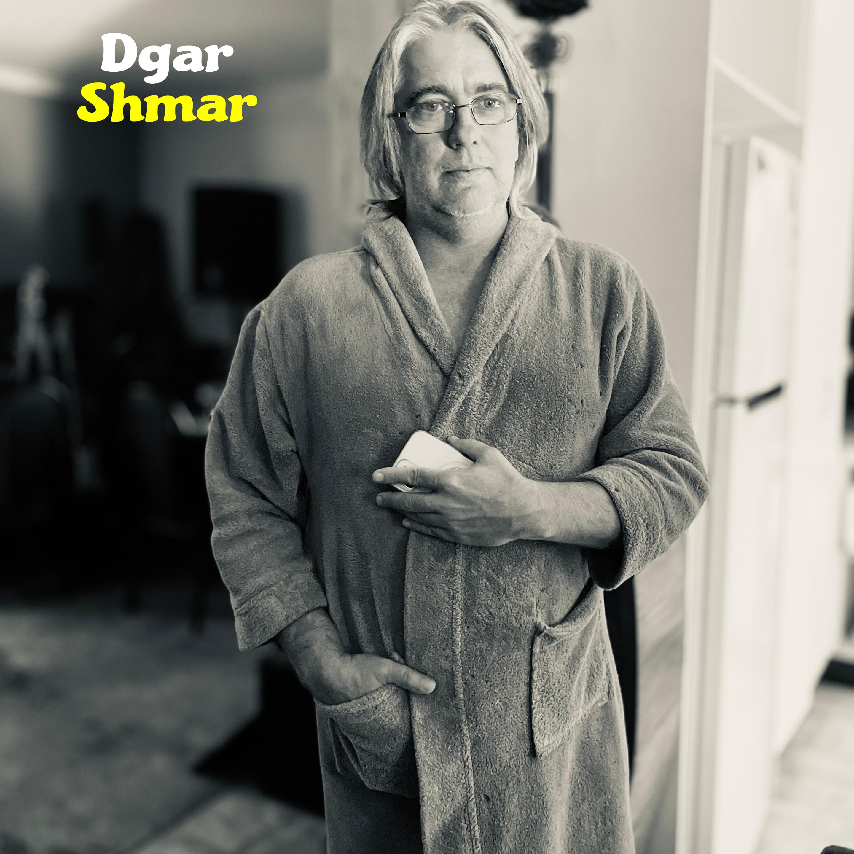 Photo of Dgar in recreation of Harry Nilsson's album cover for Nilsson Schmilsson.  The text reads "Dgar Shmar"