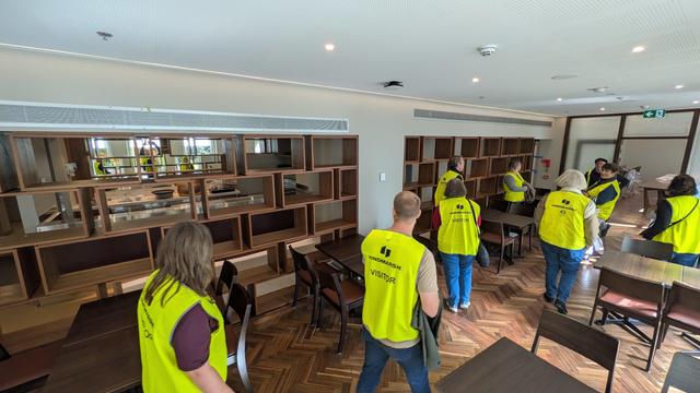 Boffins Restaurant with both the restored original parquetry floor (foreground) and new extension (right/rear). All the new updates have been given mid-century styling and fabrics including a "bricklaying" arrangement of wooden boxes separating the dining area from the bar and access corridor behind.