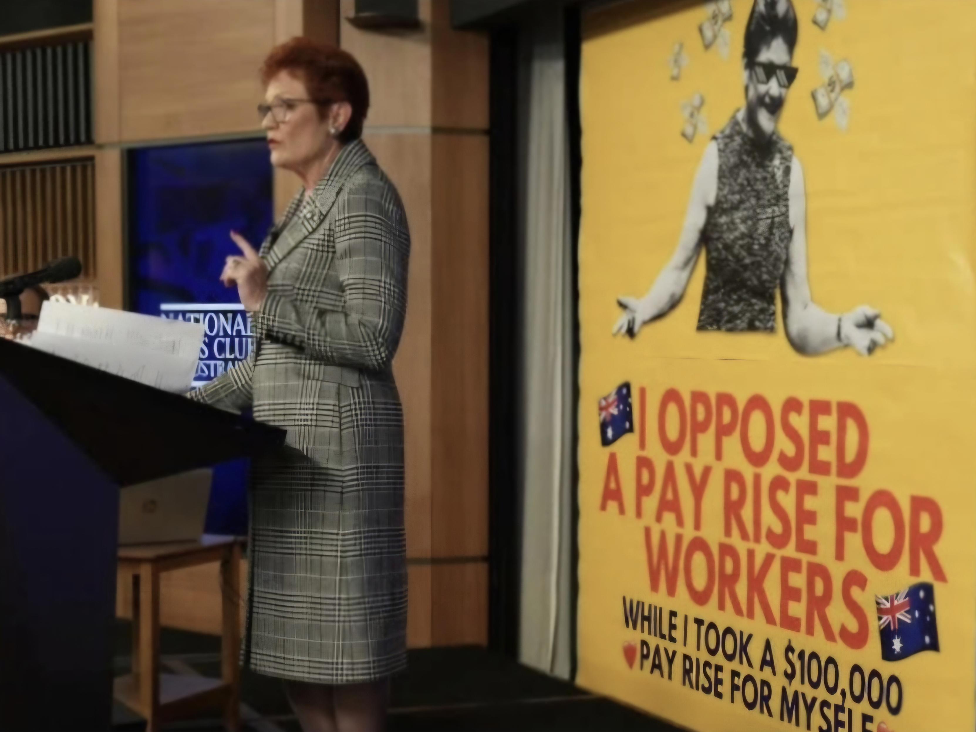 Pauline Hanson at the National Press Club with the Get Up banner behind her.