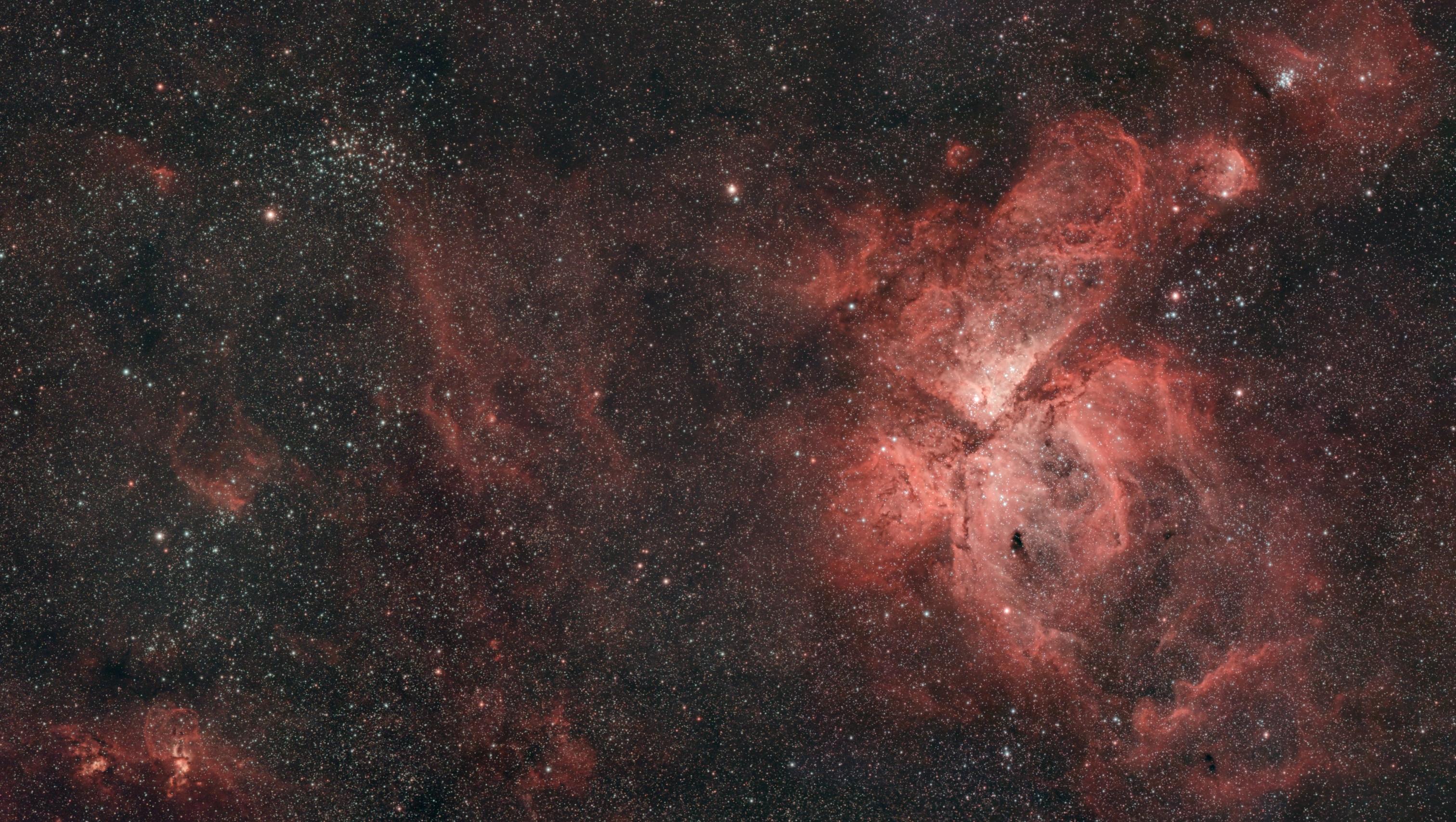 Astrophotograph featuring a big nebula, several smaller ones, some star clusters, and lots and lots of other stars. Specifically it's the Eta Carina Nebula and surrounding sky.