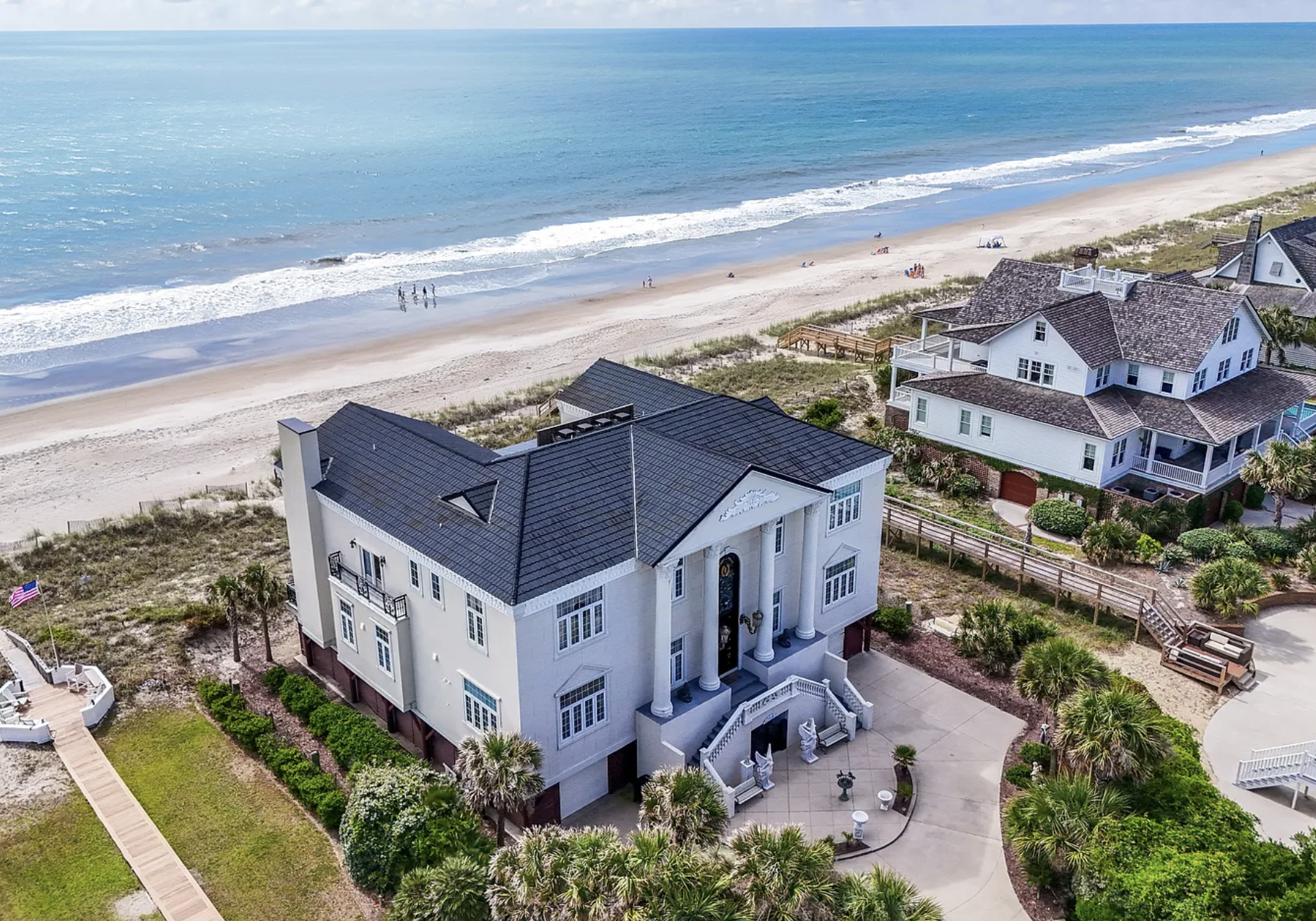A house that is very close to the edge of the ocean. it's built up high but I don't think that'd be enough.